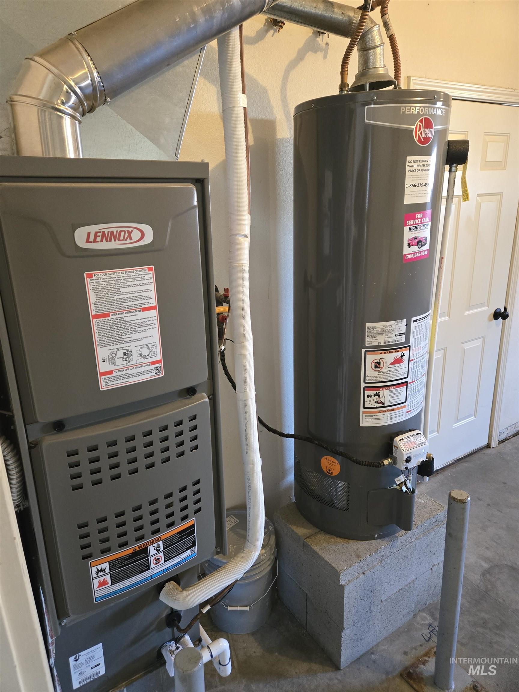 183 Southwest 18th Street Ontario, OR 97914 - Photo 32 of 32 Utility room featuring water heater and heating unit