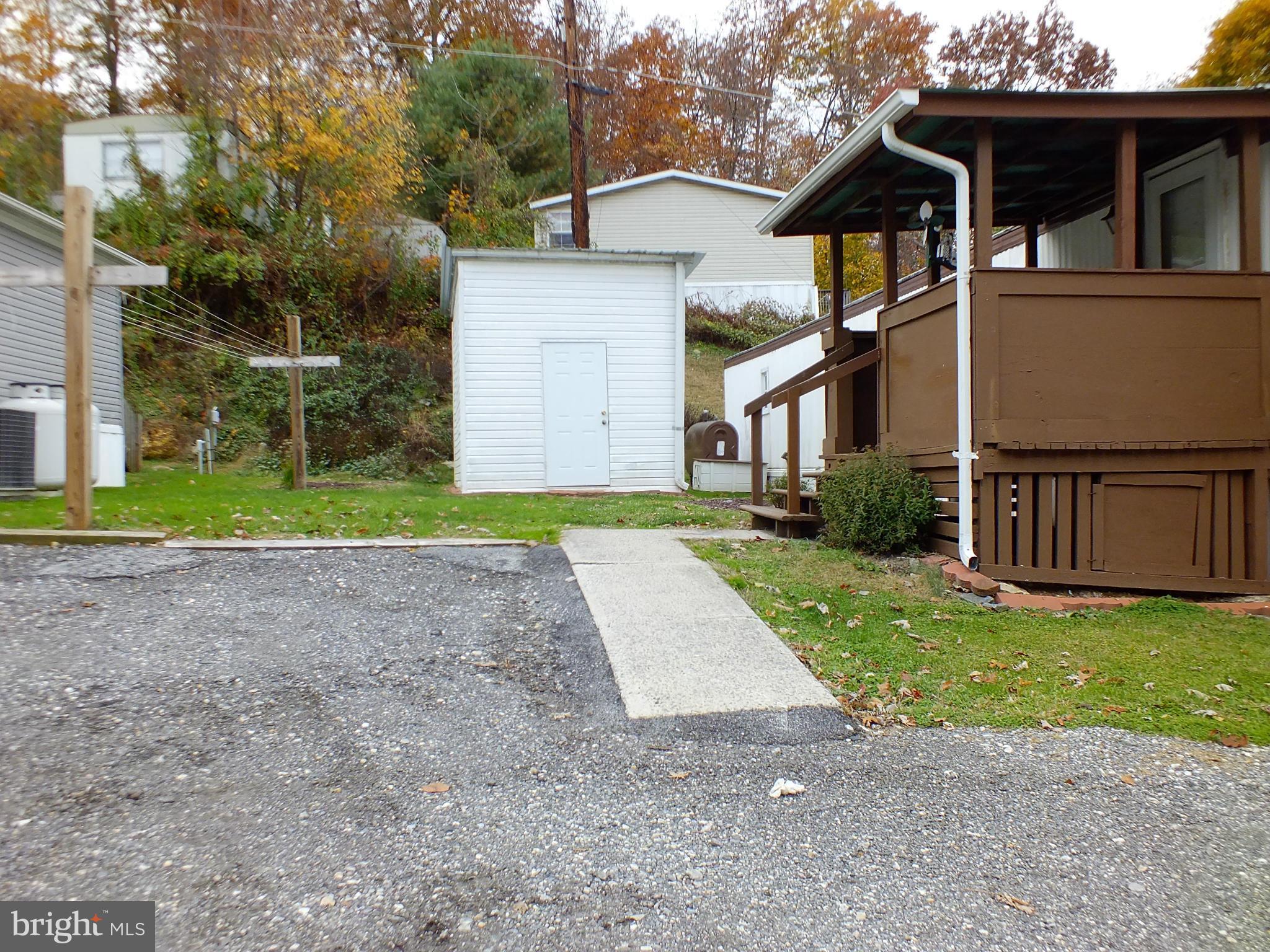 2439 Fairmount Road, Unit 16 Hampstead, MD 21074 - Photo 2 of 17 a view of a yard in front view of a house