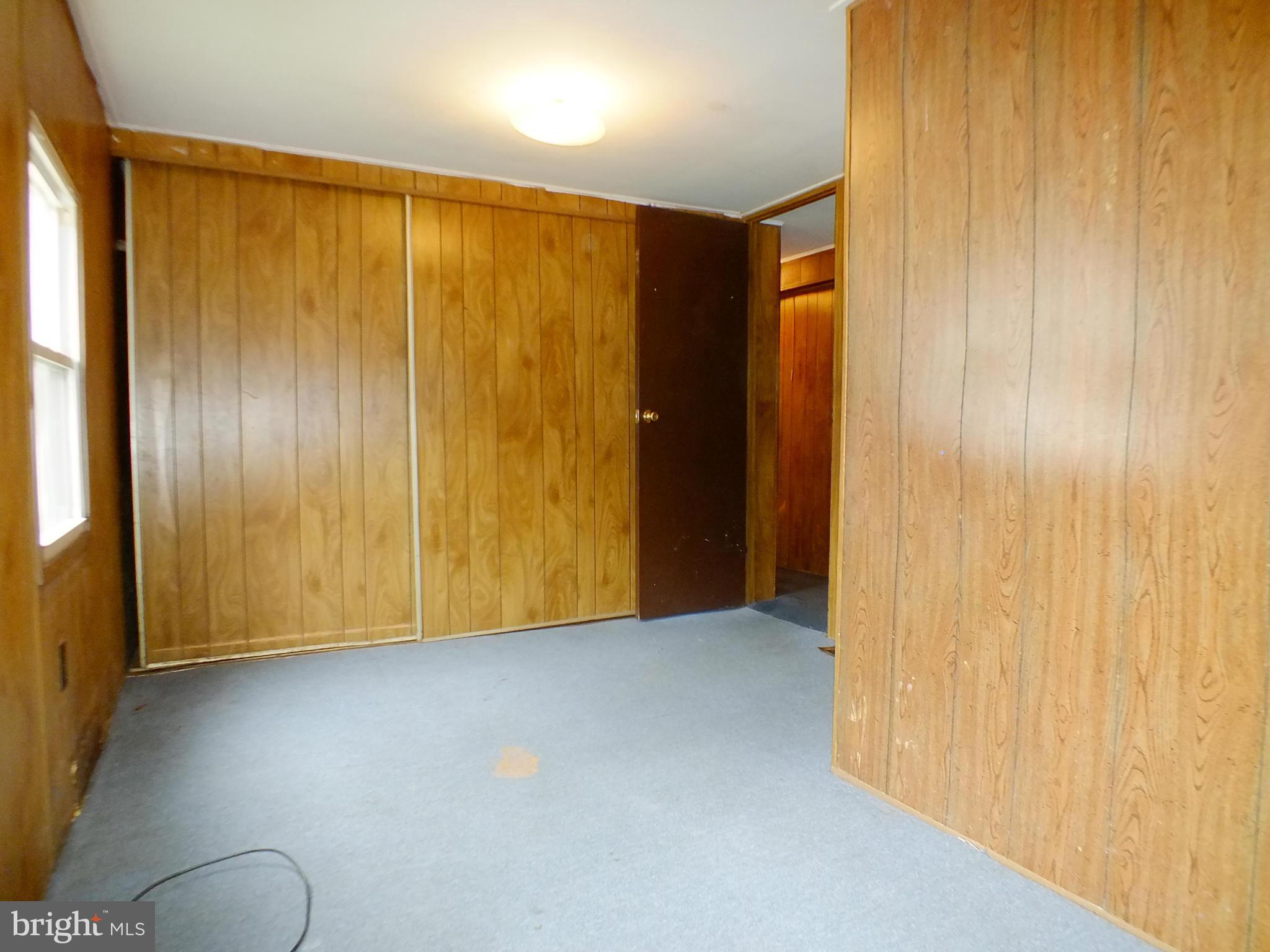 2439 Fairmount Road, Unit 16 Hampstead, MD 21074 - Photo 13 of 17 a view of an empty room with windows