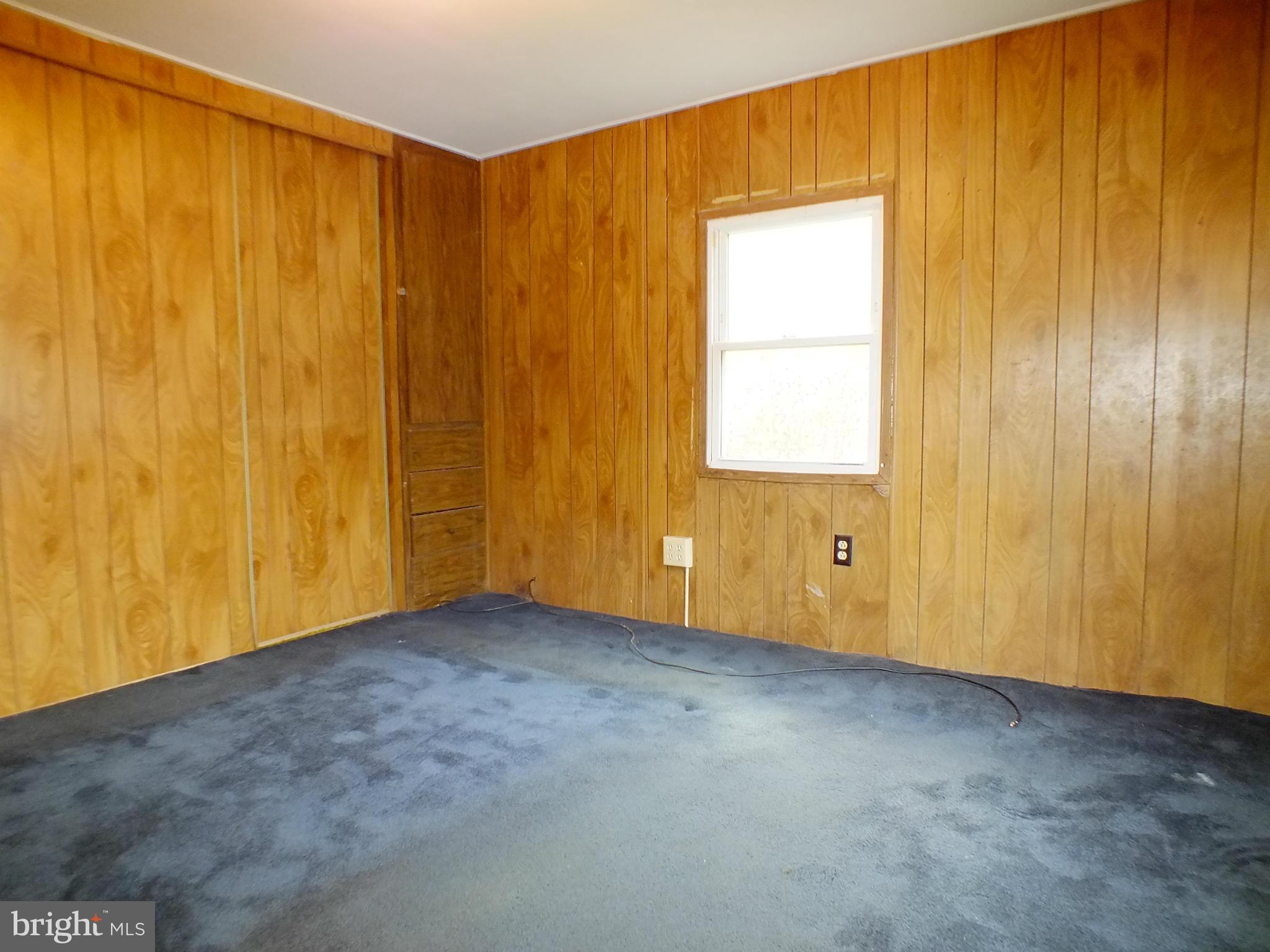 2439 Fairmount Road, Unit 16 Hampstead, MD 21074 - Photo 16 of 17 a view of an empty room with a window
