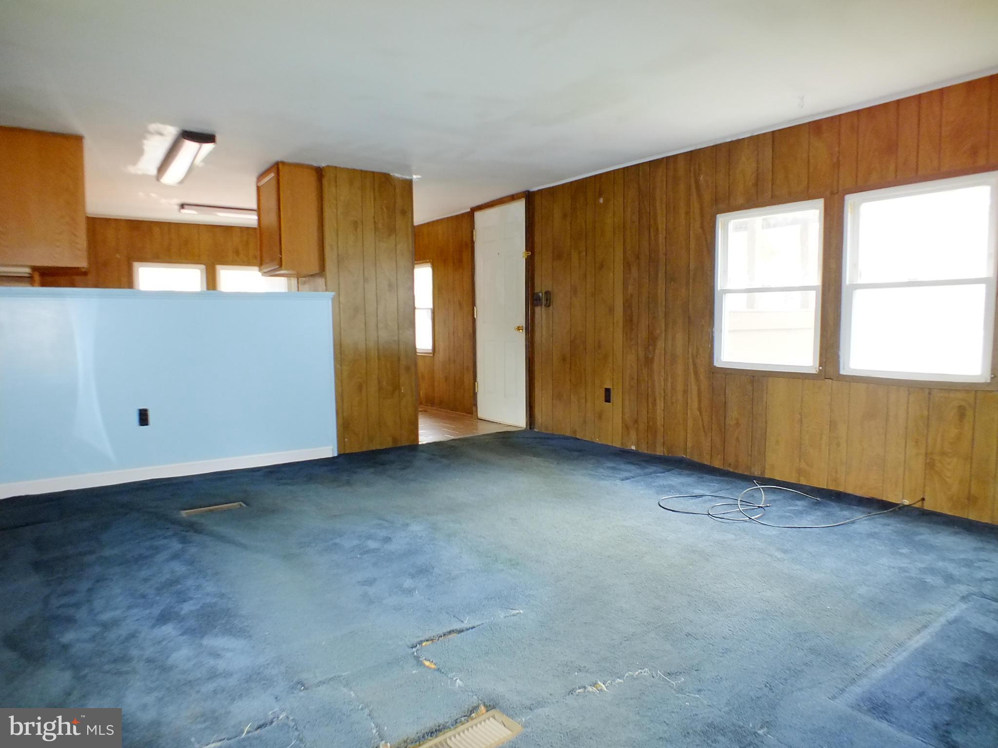 2439 Fairmount Road, Unit 16 Hampstead, MD 21074 - Photo 7 of 17 an empty room with windows