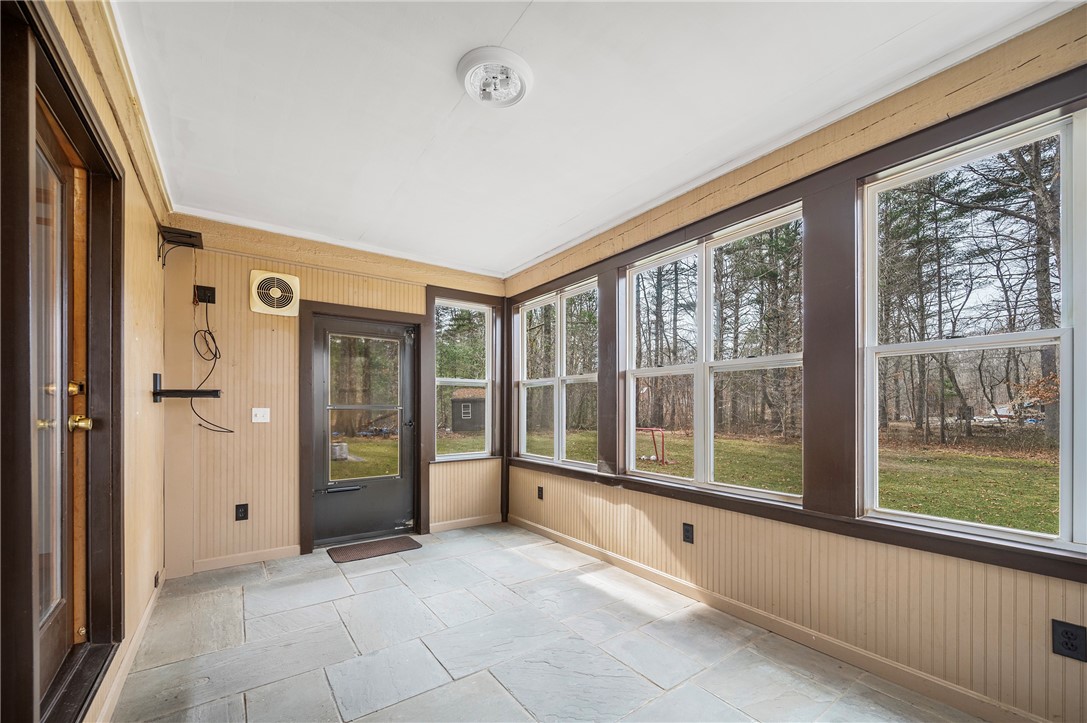 6 Running Stream Road Rehoboth, MA 02769 - Photo 10 of 48 Enclosed porch off living room overlooking rear yard