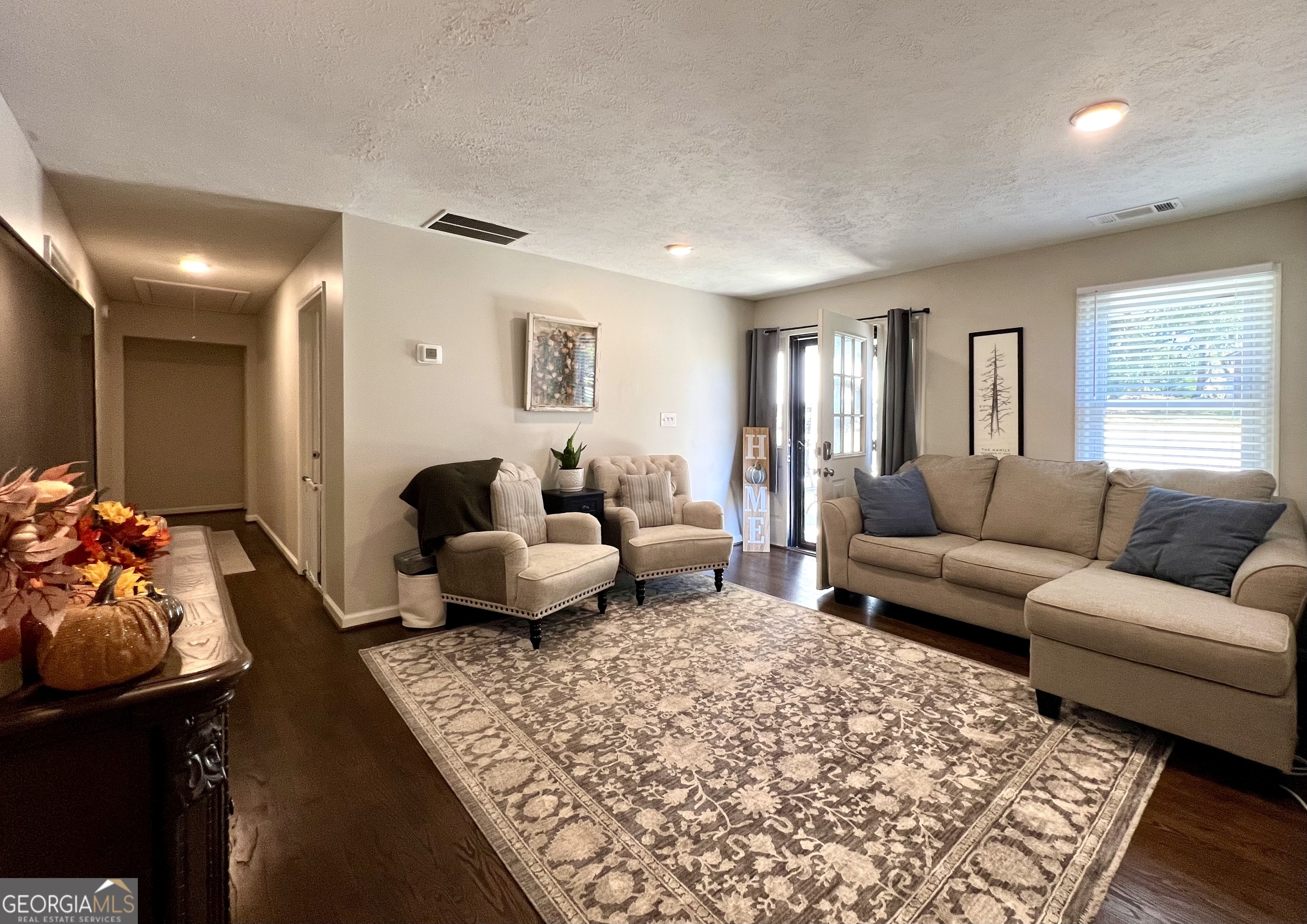 554 Spring Street Commerce, GA 30529 - Photo 11 of 58 a living room with furniture and a couch