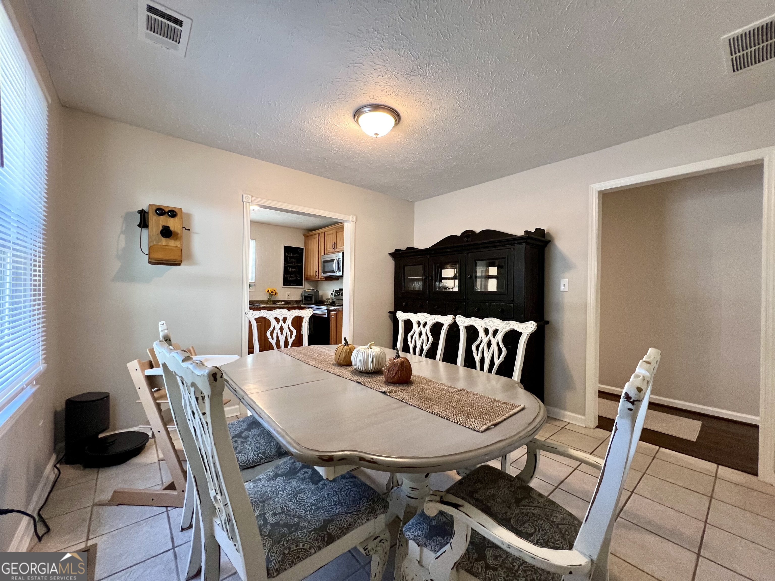 554 Spring Street Commerce, GA 30529 - Photo 13 of 58 a view of a dining room with furniture