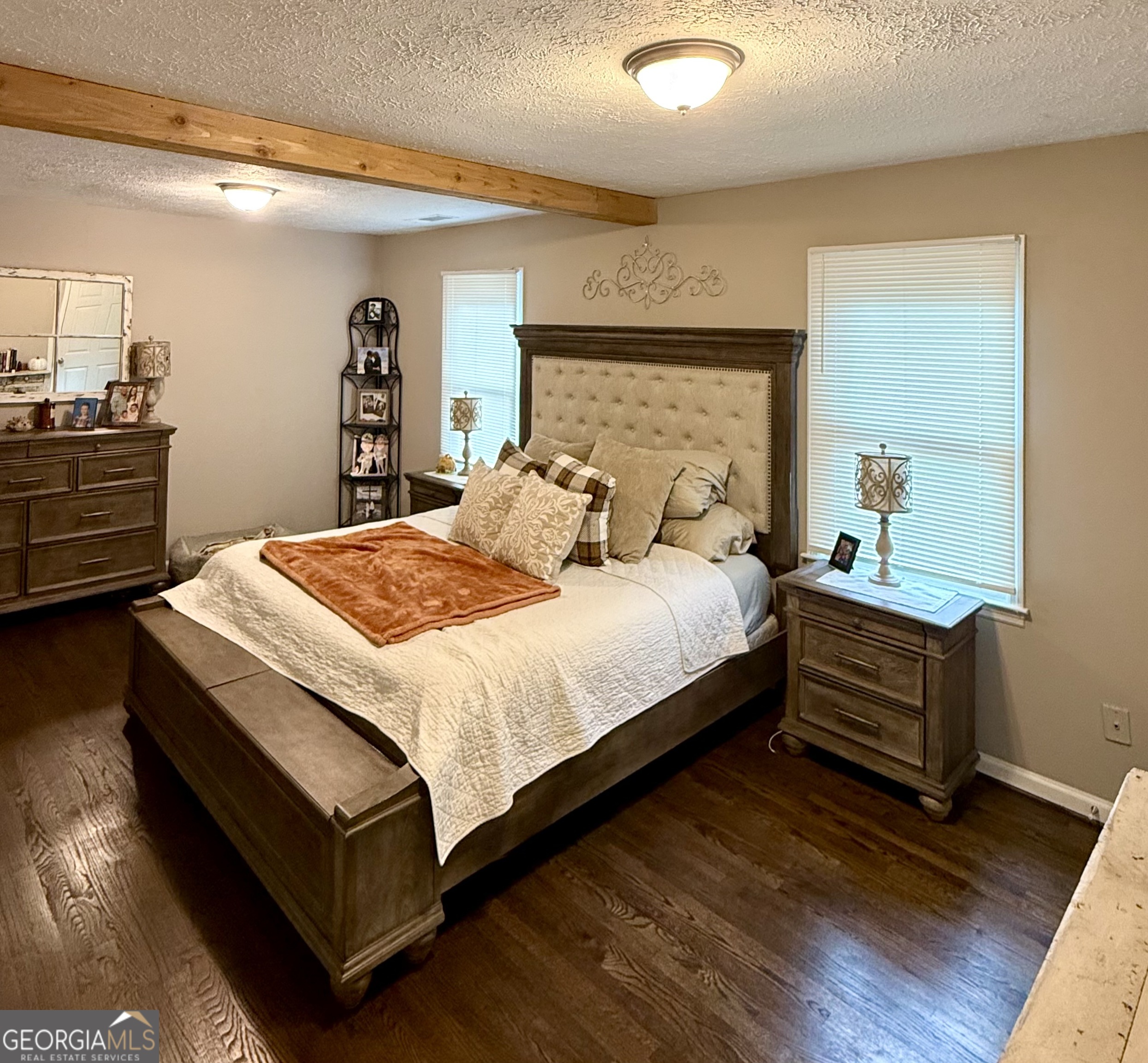 554 Spring Street Commerce, GA 30529 - Photo 23 of 58 a bedroom with a bed and a dresser