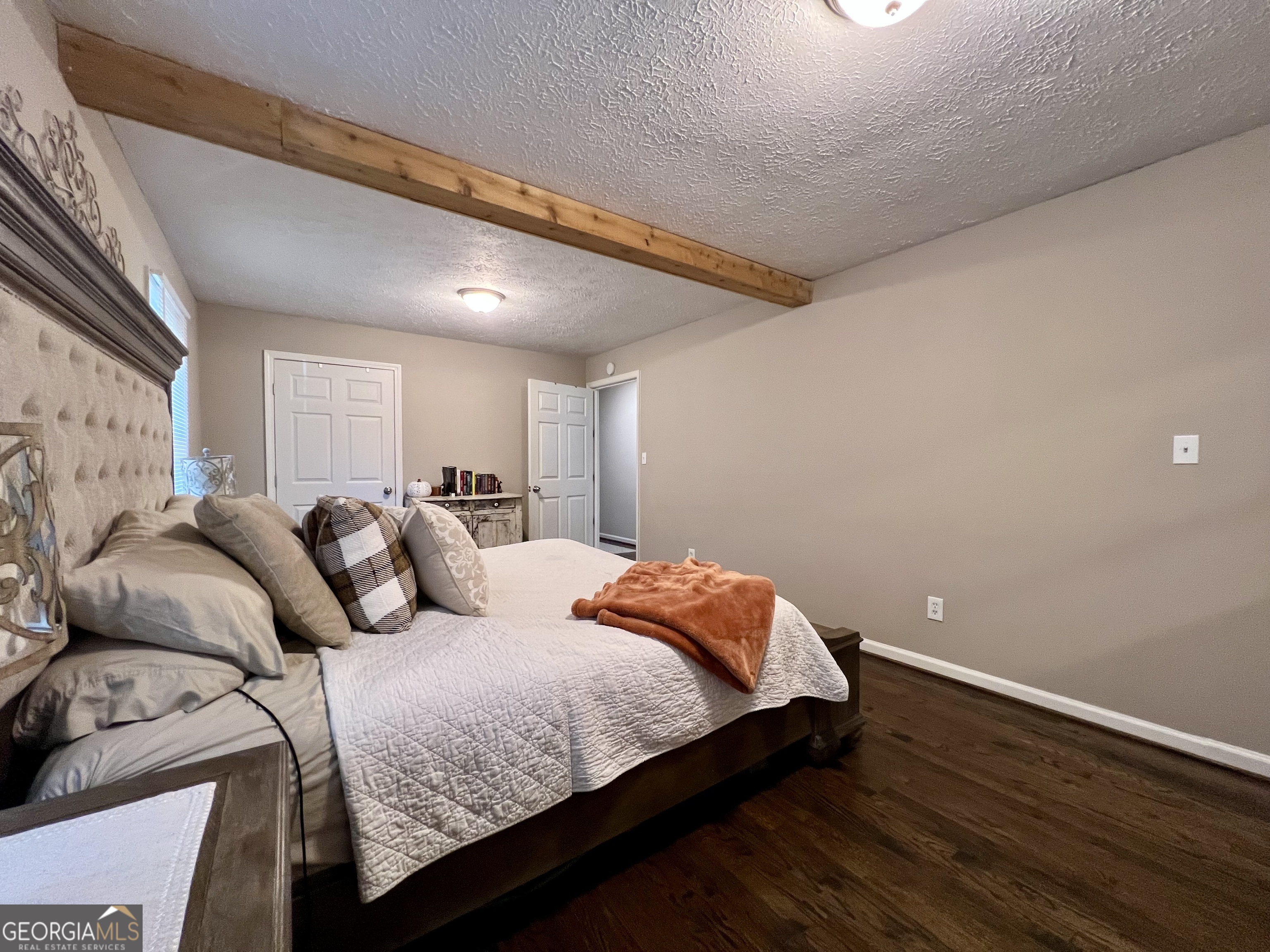 554 Spring Street Commerce, GA 30529 - Photo 25 of 58 a bedroom with a bed and a night stand