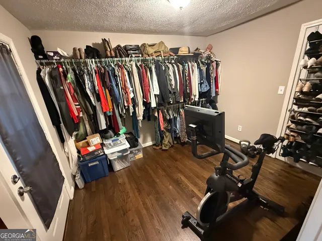 a bedroom with furniture and a rug