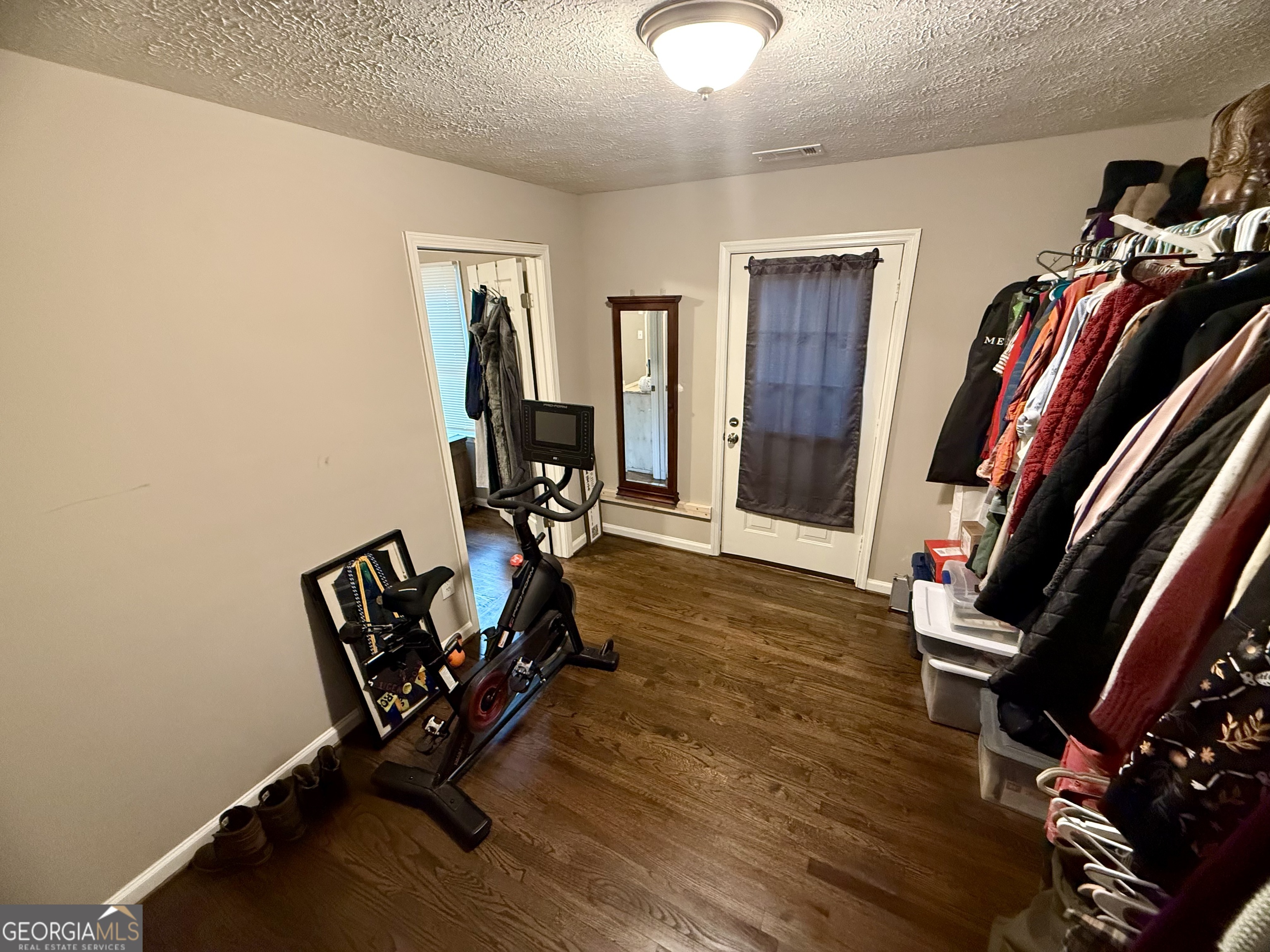 554 Spring Street Commerce, GA 30529 - Photo 33 of 58 a view of a room with furniture and wooden floor