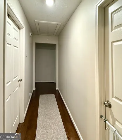 a bedroom with a bed and a table in it