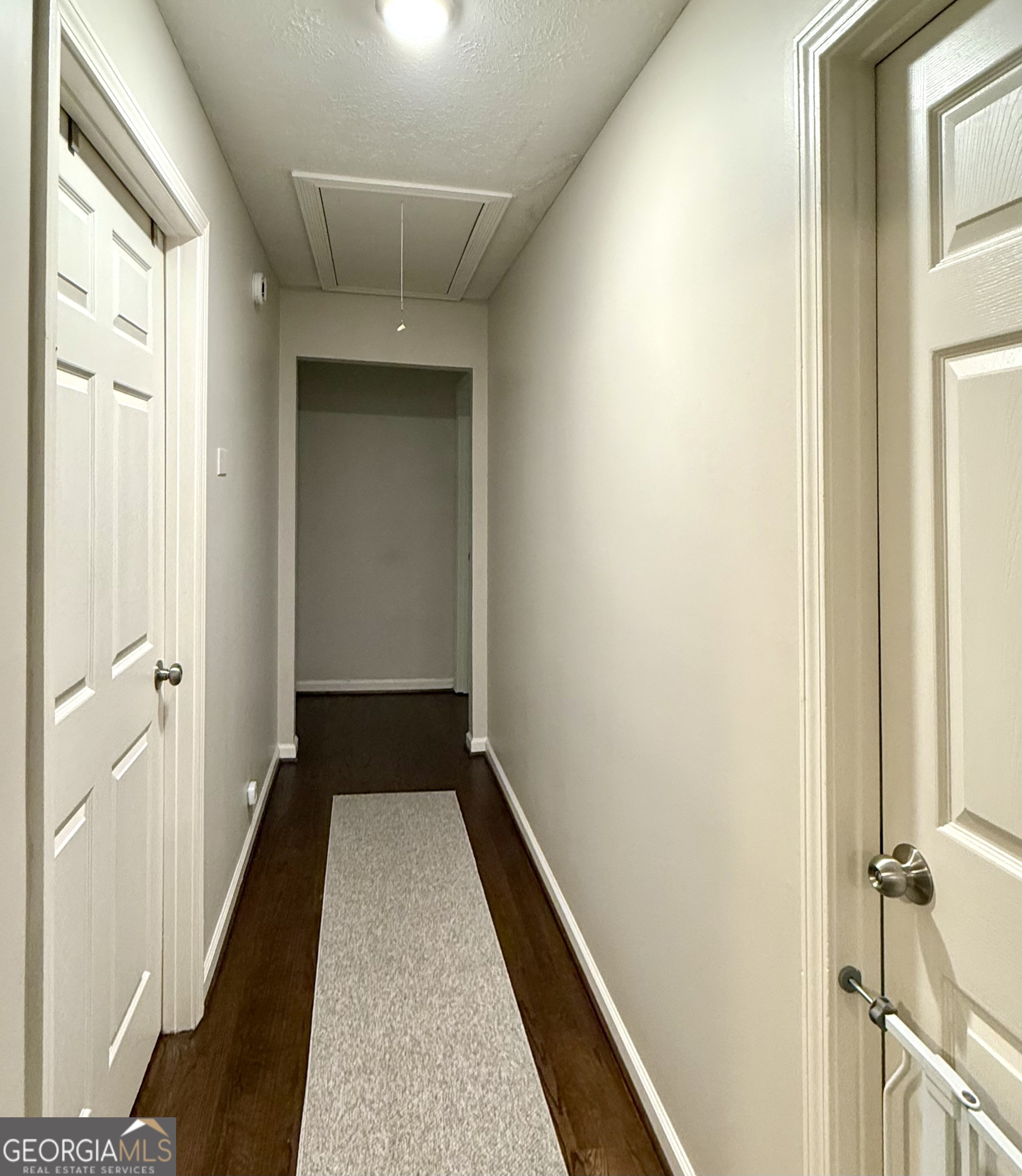 554 Spring Street Commerce, GA 30529 - Photo 34 of 58 a view of a hallway with wooden floor and staircase