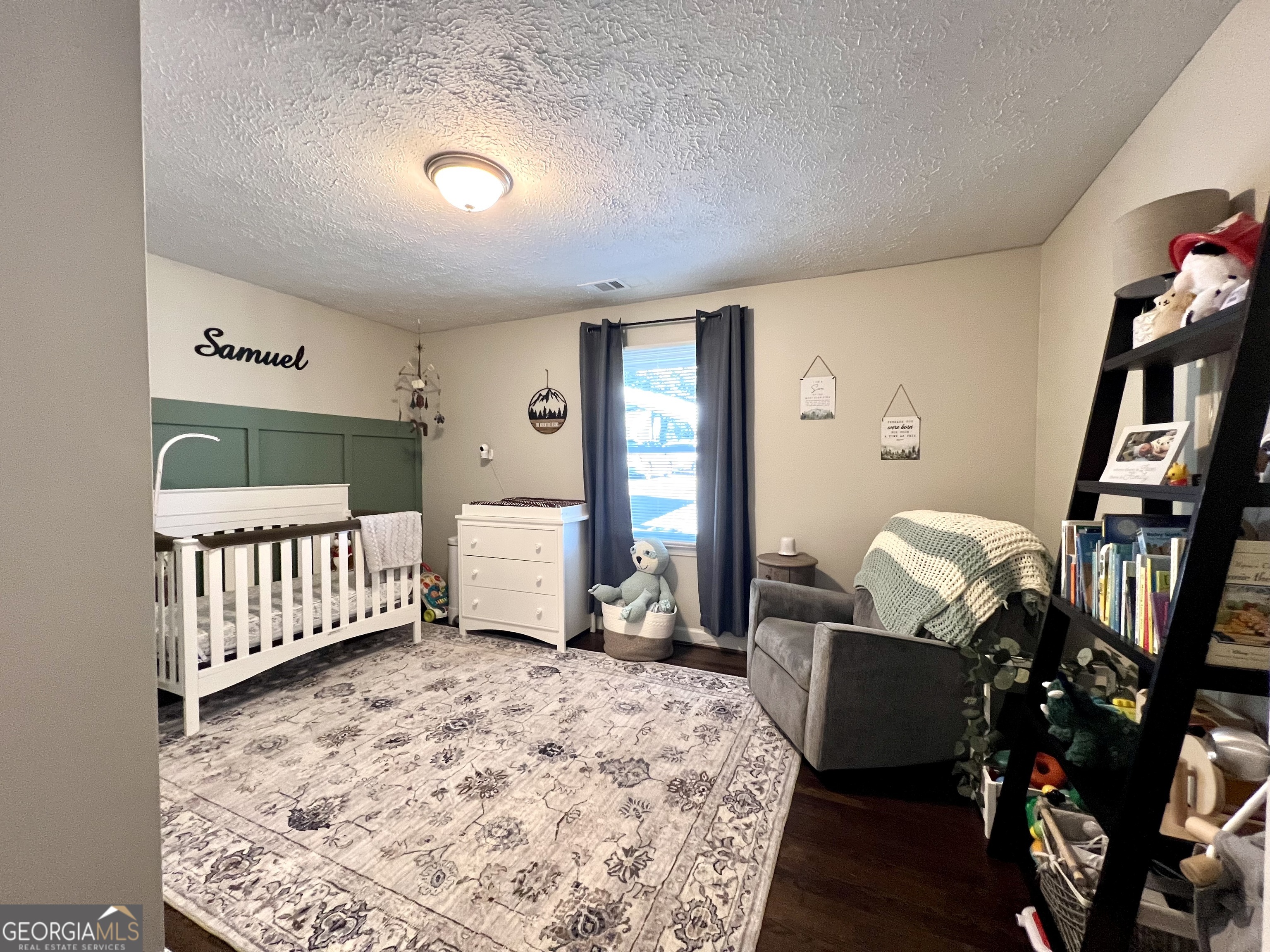 554 Spring Street Commerce, GA 30529 - Photo 35 of 58 a bedroom with furniture and a rug