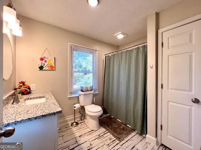 a bedroom with a bed and a table in it