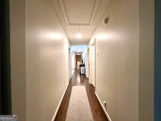 a room with furniture a rug and a window