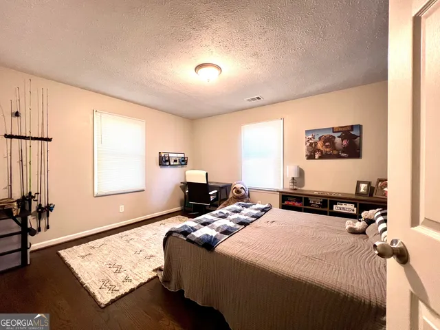 a view of sitting area with furniture and tables