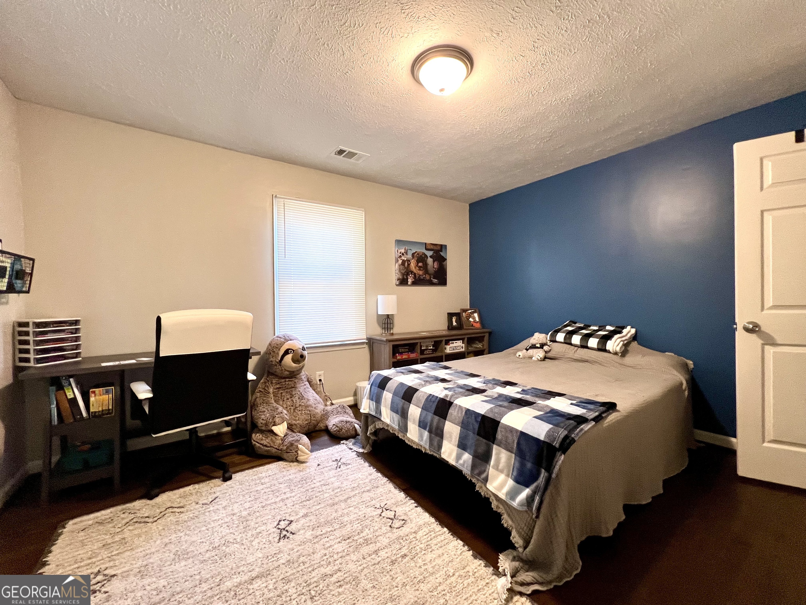 554 Spring Street Commerce, GA 30529 - Photo 47 of 58 a bedroom with double bed and a window