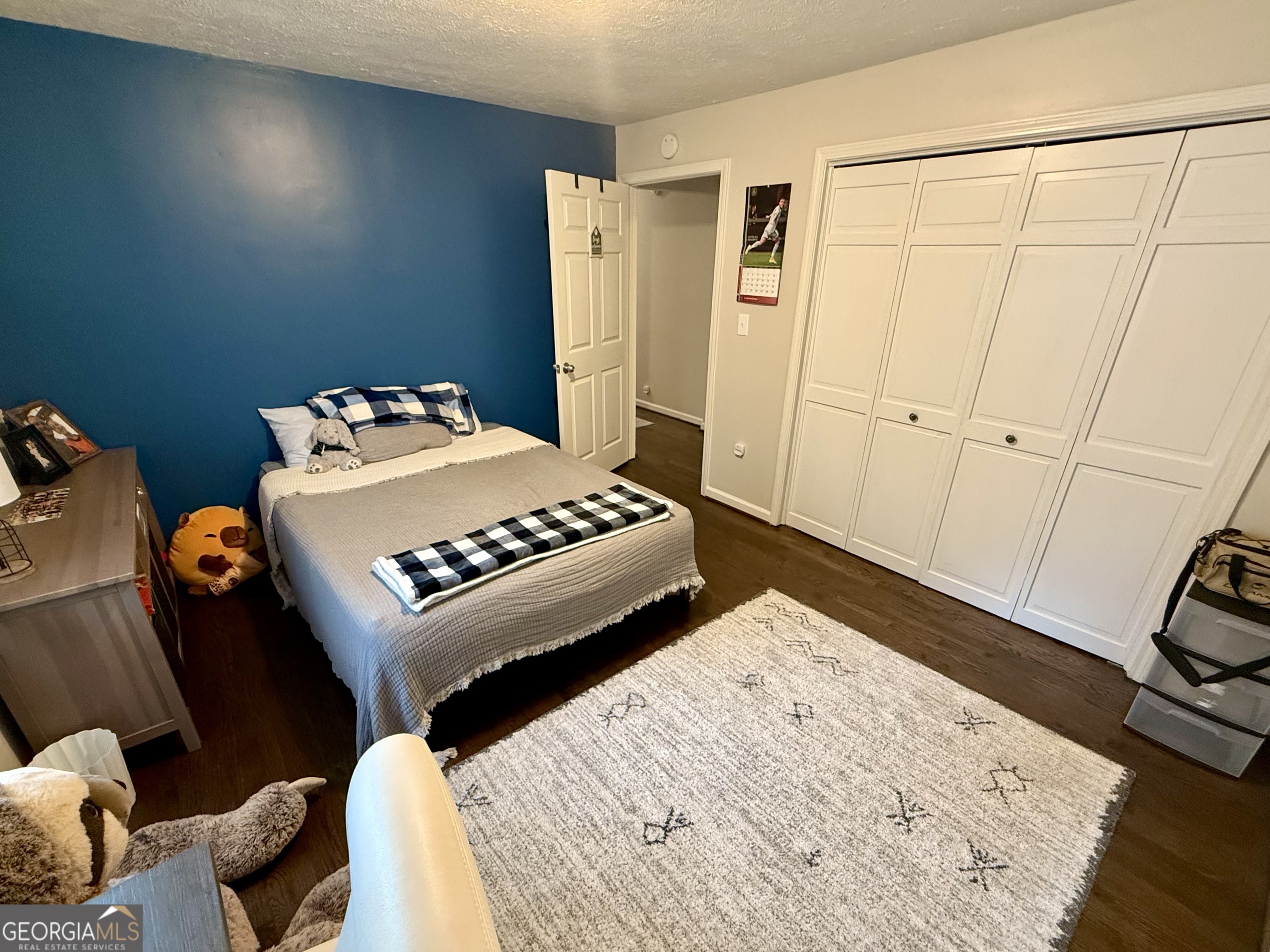 554 Spring Street Commerce, GA 30529 - Photo 48 of 58 a bedroom with a bed and a table in it