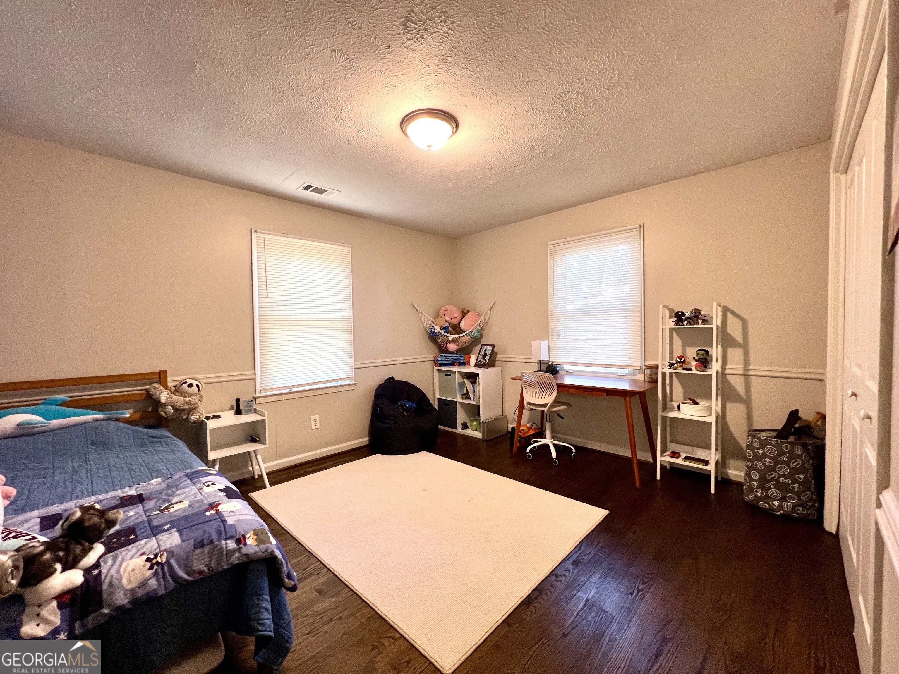 554 Spring Street Commerce, GA 30529 - Photo 50 of 58 a room with furniture a rug and a window