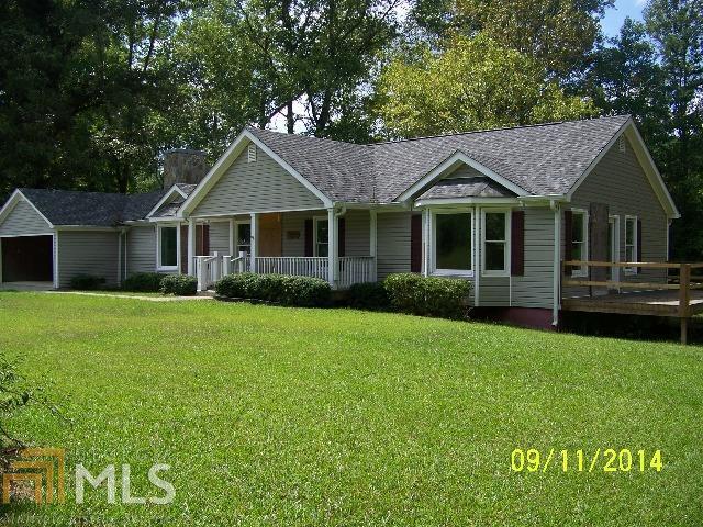 120 Boise Road Franklin, GA 30217 - Photo 1 of 1 a front view of a house with a garden
