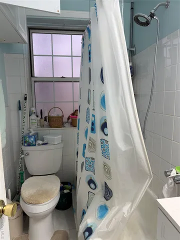 a bathroom with a toilet a sink and a bathtub