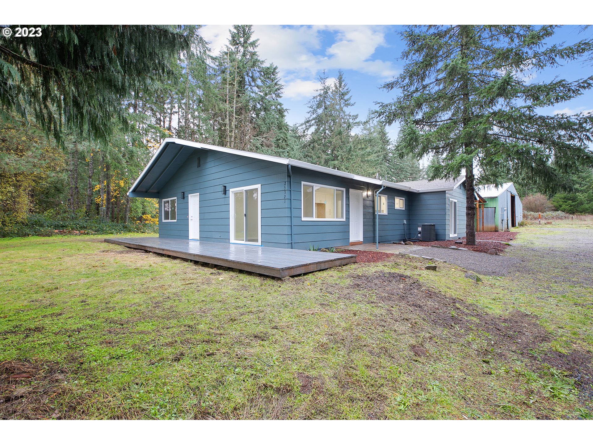25331 South Larkin Road Beavercreek, OR 97004 - Photo 1 of 44 a backyard of a house with lots of green space