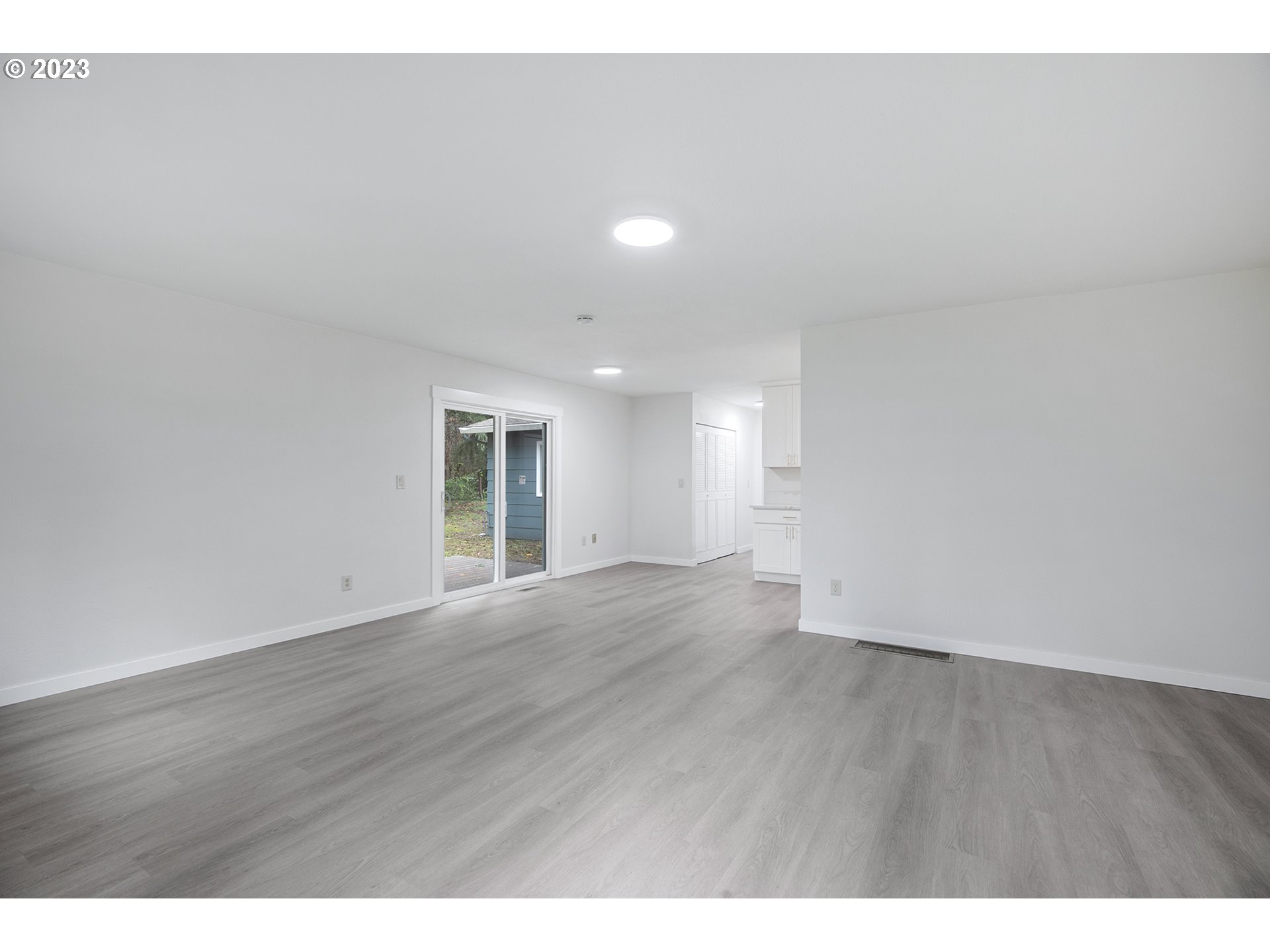 25331 South Larkin Road Beavercreek, OR 97004 - Photo 18 of 44 a view of an empty room with wooden floor and a window