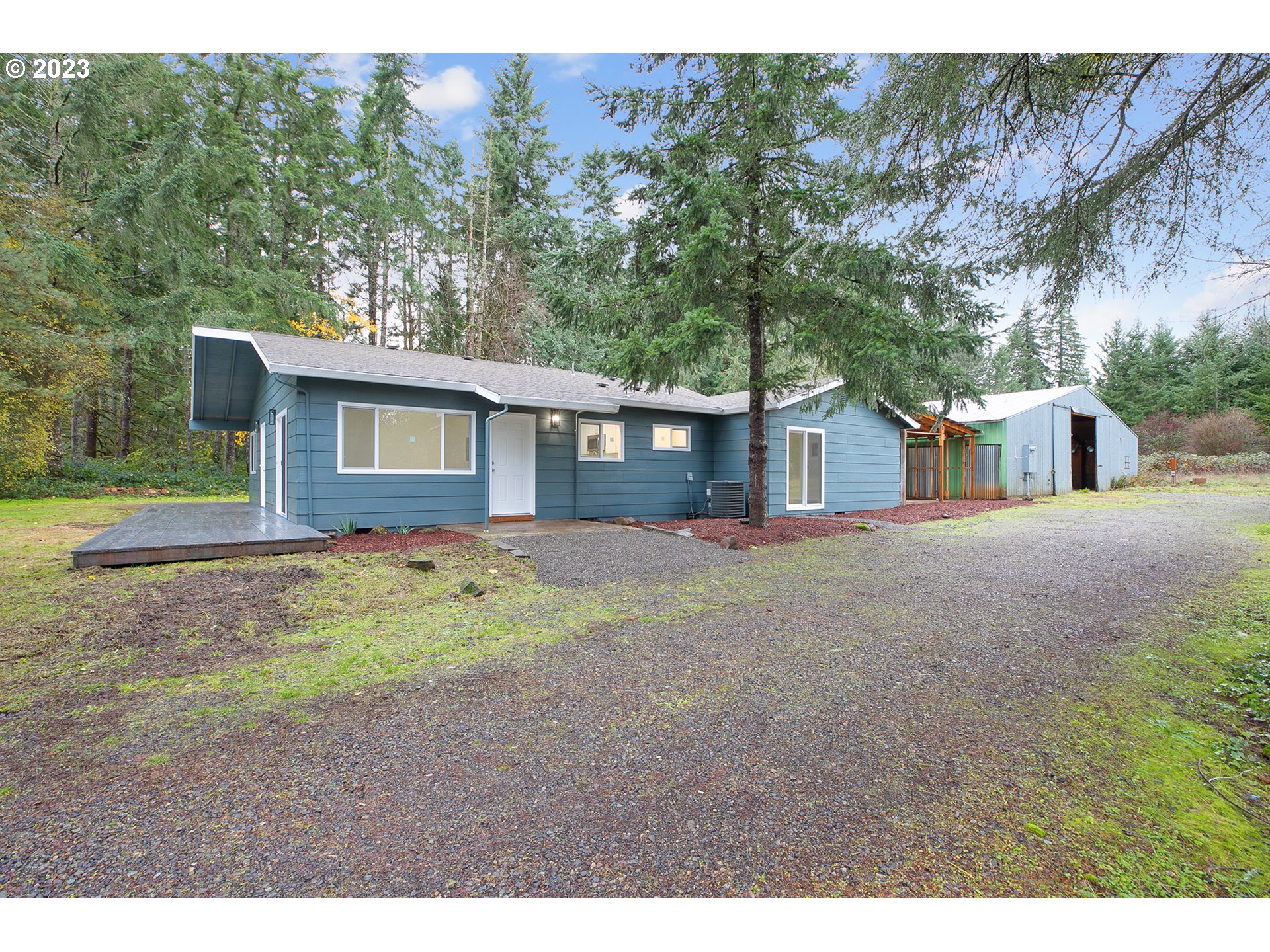 25331 South Larkin Road Beavercreek, OR 97004 - Photo 2 of 44 a view of a house with backyard and trees