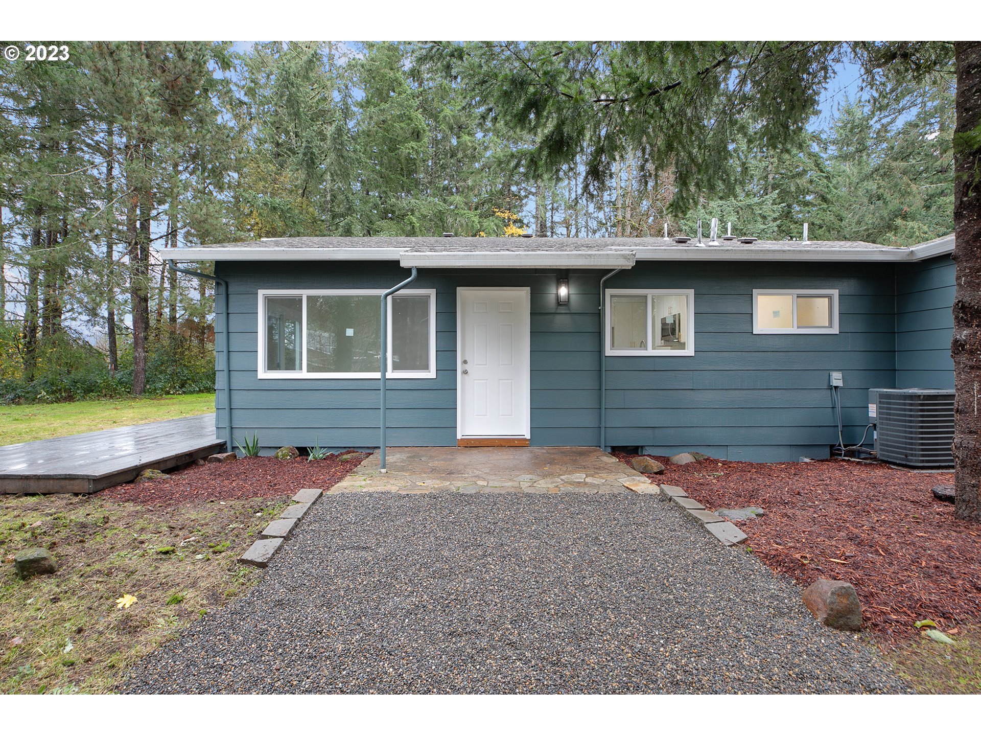 25331 South Larkin Road Beavercreek, OR 97004 - Photo 3 of 44 a backyard of a house with a yard and garage