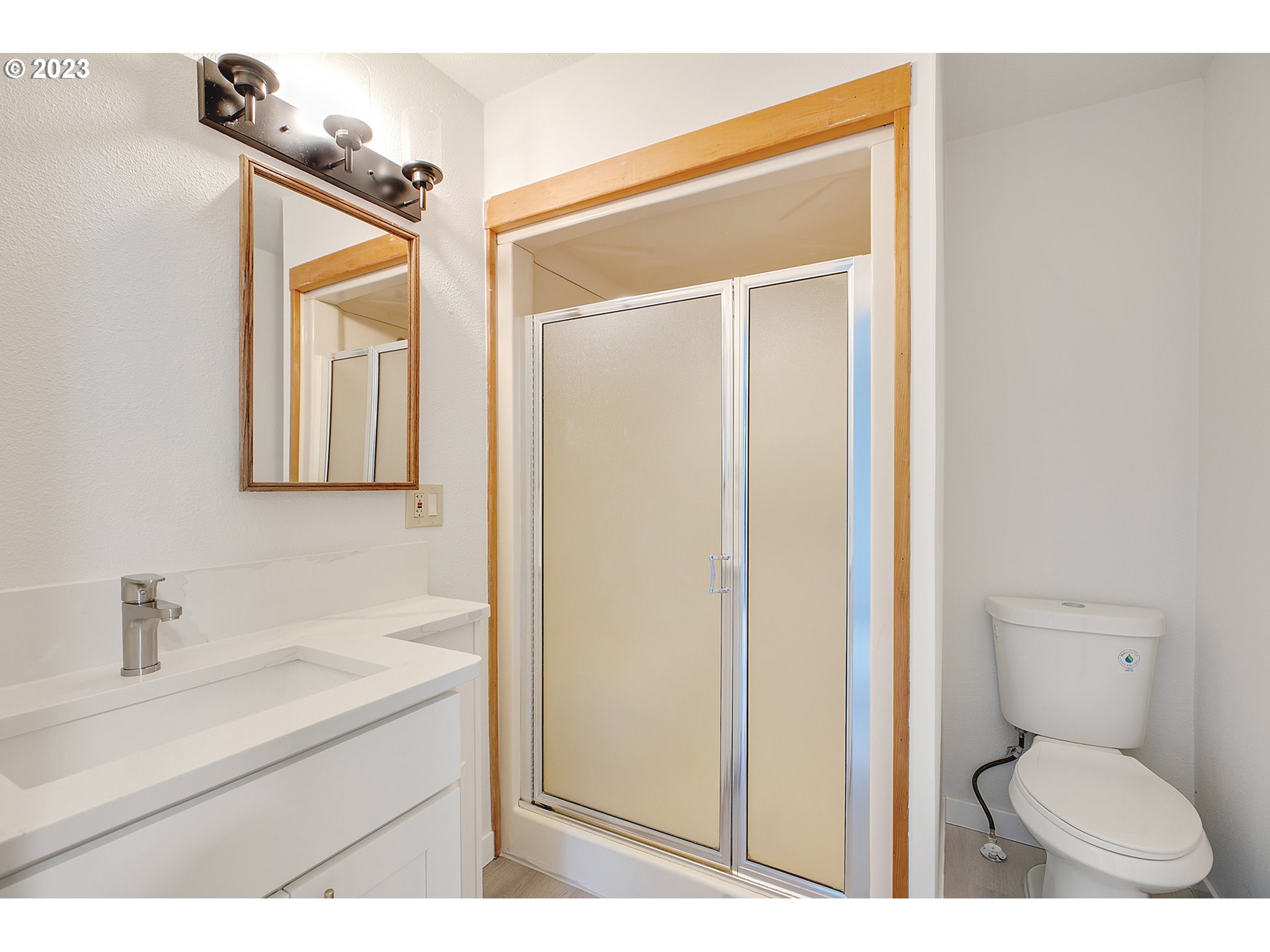 25331 South Larkin Road Beavercreek, OR 97004 - Photo 32 of 44 a bathroom with a toilet a sink and mirror