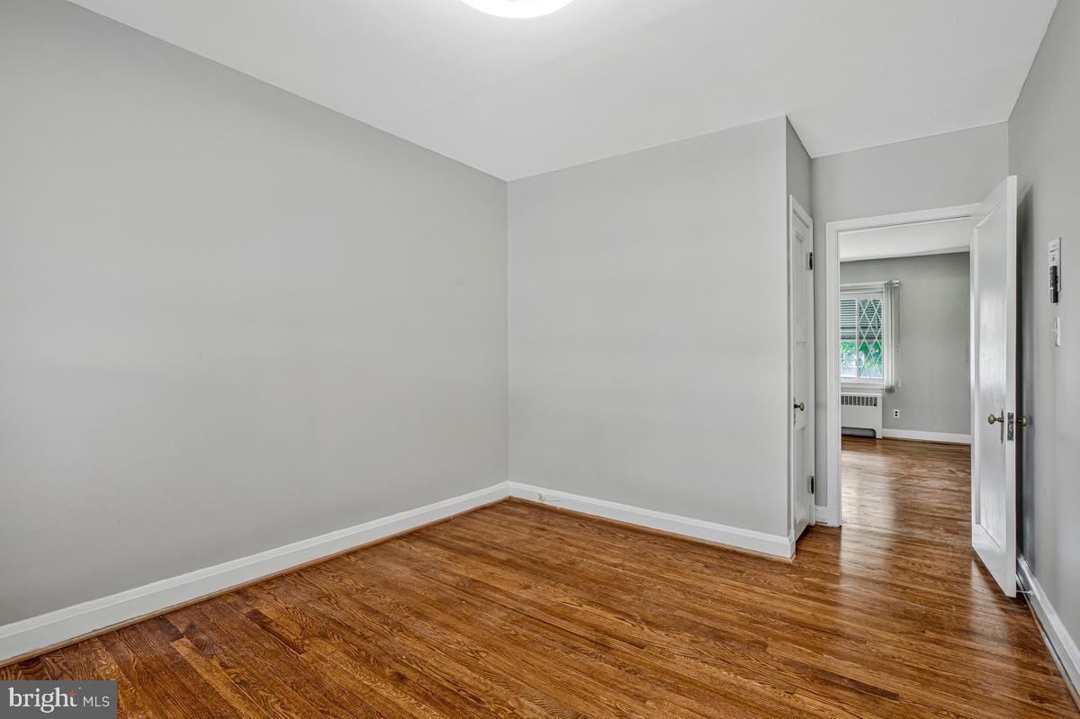 3040 Federal Street Baltimore, MD 21213 - Photo 16 of 41 a view of a room with wooden floor and bench