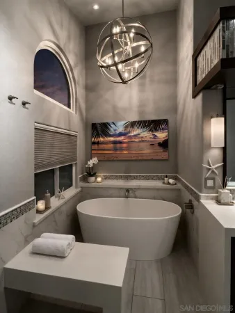 a view of a living room and chandelier