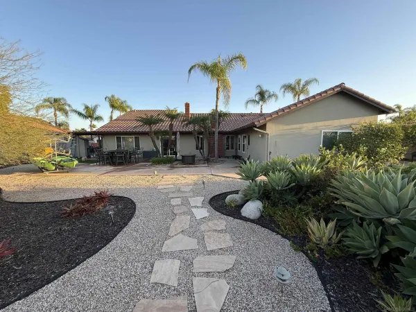 a view of a house with a yard