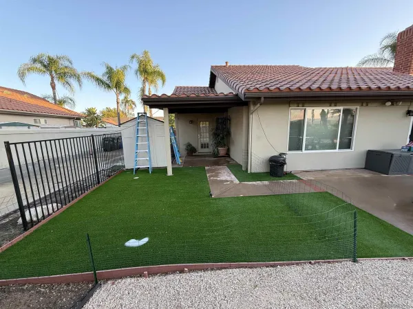 a view of a house with pool and sitting area