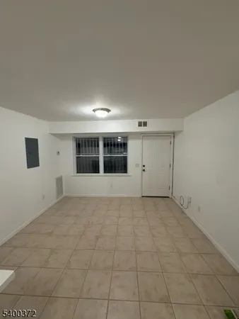 a view of an empty room with a sink