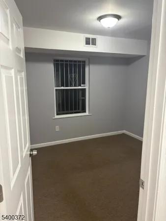 an empty room with closet area