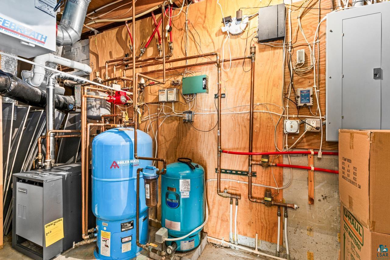 67 Snowshoe Trail Tofte, MN 55615 - Photo 40 of 42 Utilities featuring electric panel and heating unit