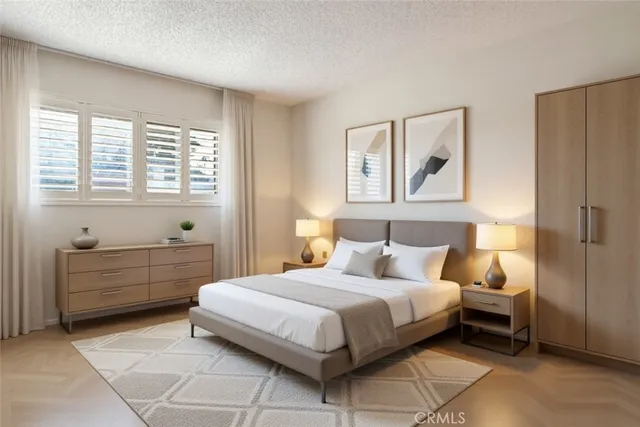 a bedroom with a bed and a window