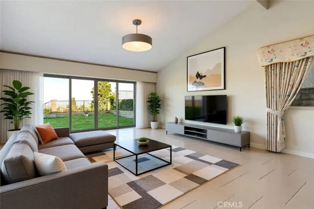 a living room with furniture tv and a large window