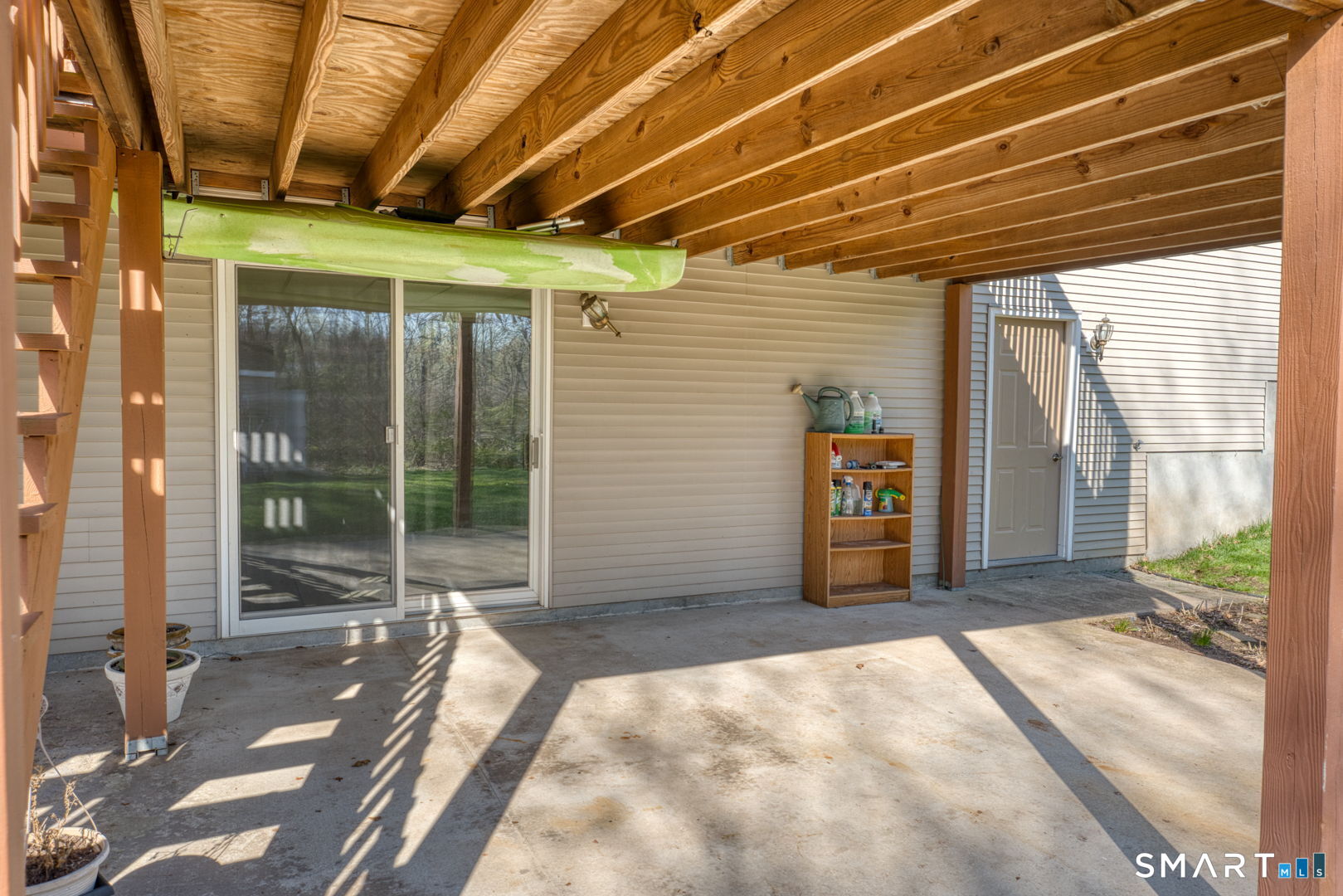 57 4 Rod Road Berlin, CT 06037 - Photo 25 of 31 a view of a porch with a table and chairs