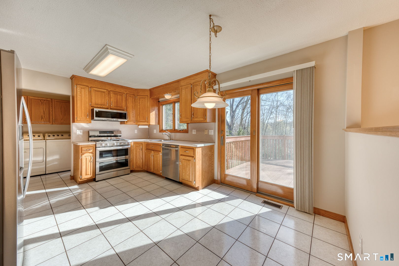 57 4 Rod Road Berlin, CT 06037 - Photo 7 of 31 a kitchen with stainless steel appliances granite countertop a refrigerator and a sink
