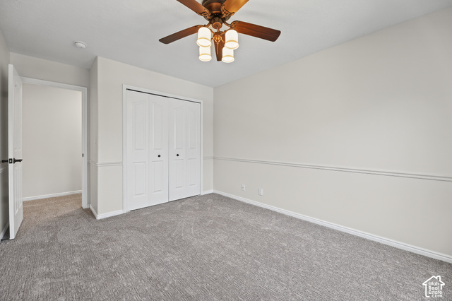 10664 Trail Ridge Circle Sandy, UT 84092 - Photo 34 of 113 Wall-to-wall carpeting, bi-fold closet doors, ceiling fan with integrated lighting, and paneled wainscoting