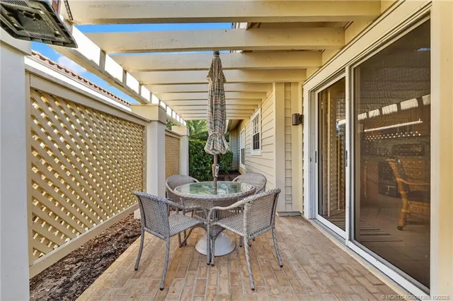 a view of a hallway with closet and a couch