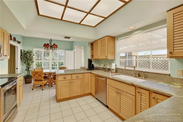 a bed room with a bed and a chandelier