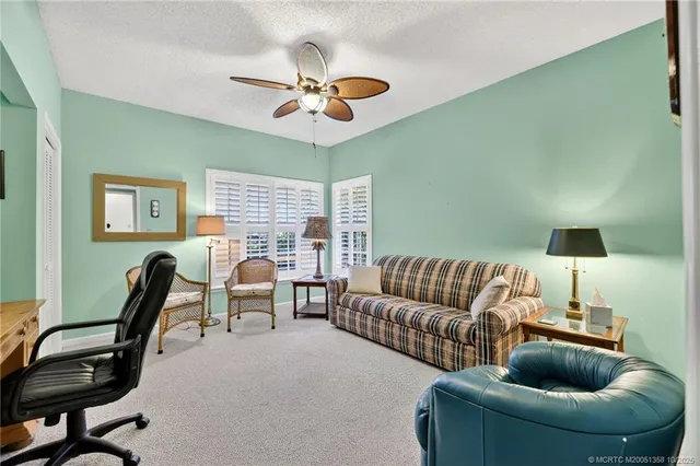 a bedroom with a bed and cabinets