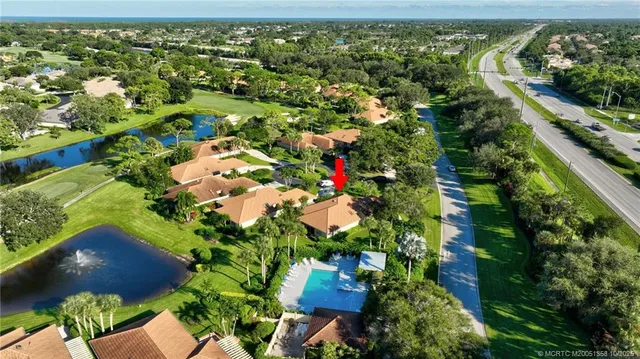 an aerial view of house with yard