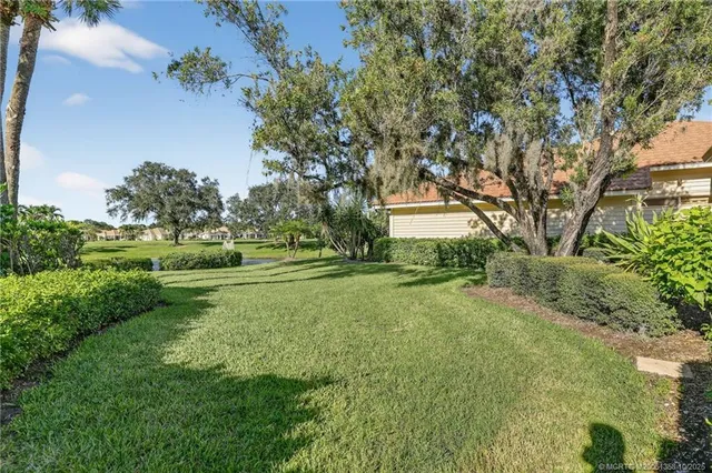 a view of backyard with green space