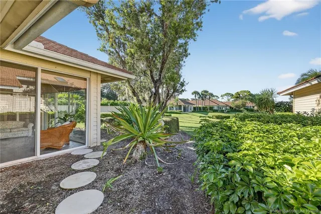 a balcony with table and chairs