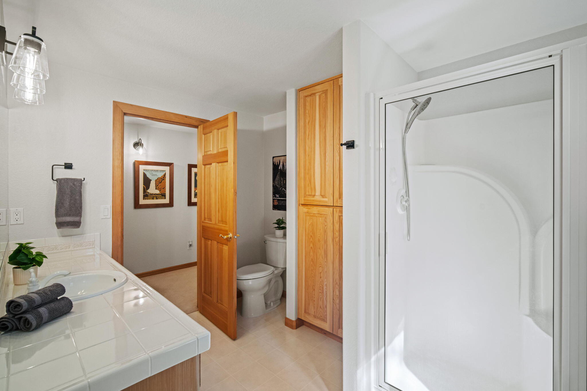 17948 Shadow Lane, Unit 7 Sunriver, OR 97707 - Photo 65 of 92 a bathroom with a granite countertop sink a mirror and shower