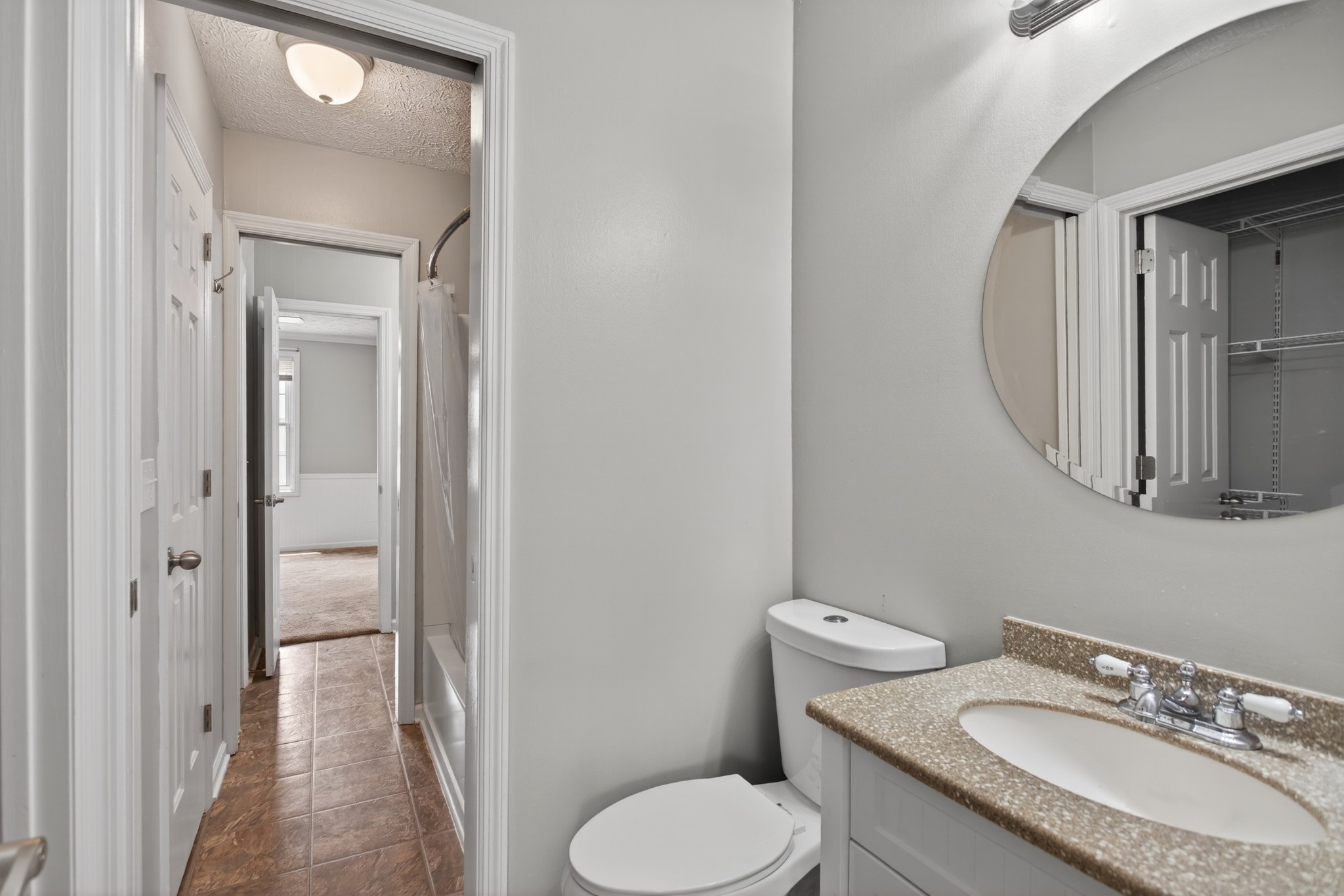 430 Walton Ferry Road, Unit 200 Hendersonville, TN 37075 - Photo 16 of 16 a bathroom with a granite countertop toilet sink and mirror