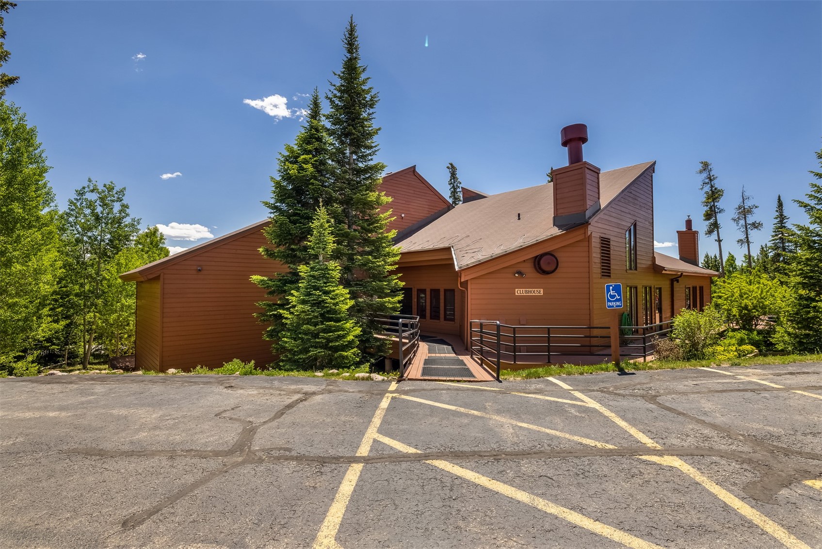 91400 Ryan Gulch Road, Unit 408B Silverthorne, CO 80498 - Photo 15 of 25 a view of a house with a yard and garage