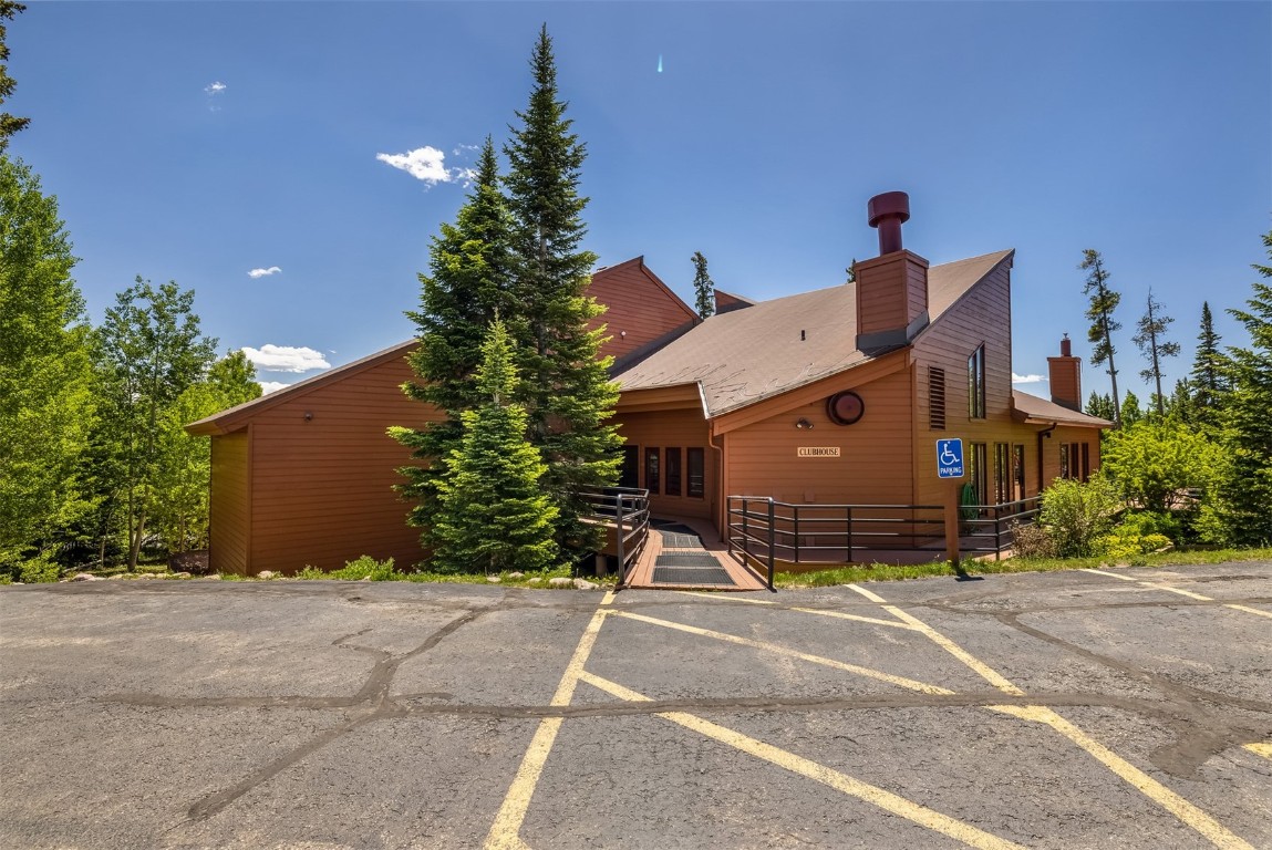 91400 Ryan Gulch Road, Unit 408B Silverthorne, CO 80498 - Photo 16 of 26 a view of a house with a yard and garage